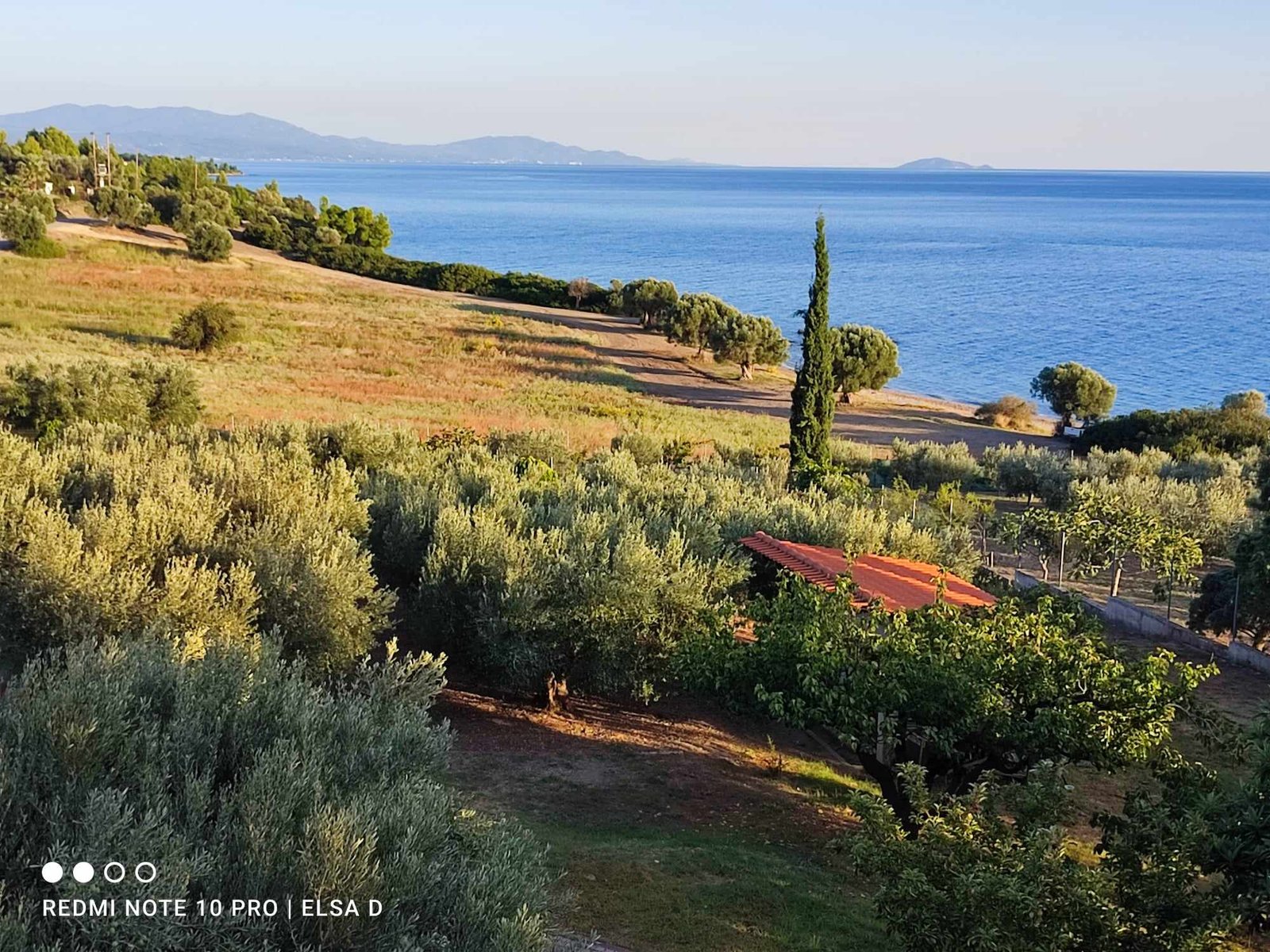 Interior view of the 3 Olive Trees house showing rustic furniture and stone floor